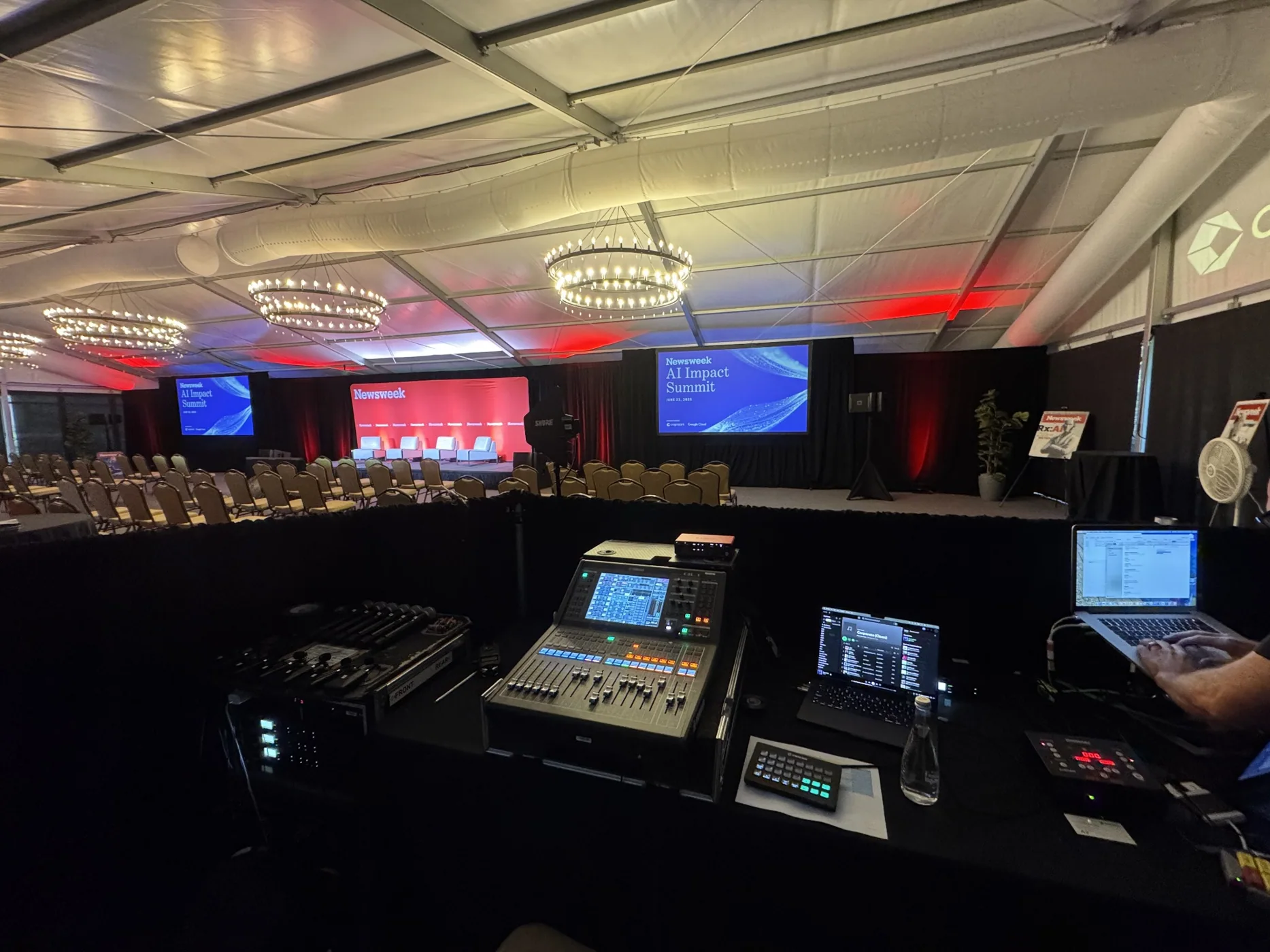 Purple-lit corporate general session stage